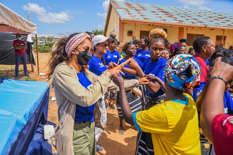 The maverick fellows join Pendo in a dance during their graduation.
